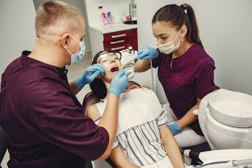 Top 5 Cosmetic Dentistry Treatments That Are All the Rage in 2025 Dentist Performing Cosmetic Dental Procedure 2025