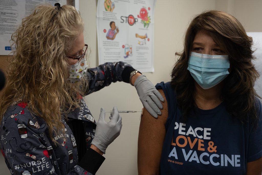Measles Cases Climb Again: A Calm Look at the Numbers Healthcare worker preparing a measles vaccine dose at a clinic